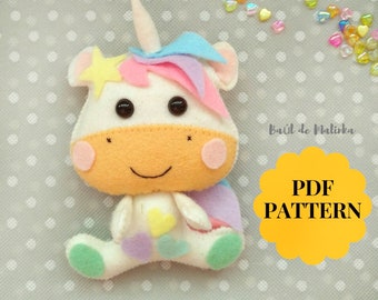 May include: A PDF pattern for sewing a felt unicorn toy. The unicorn is white with a pink, blue, and yellow mane and tail. It has a yellow star on its forehead and big brown eyes. The pattern is available for download.