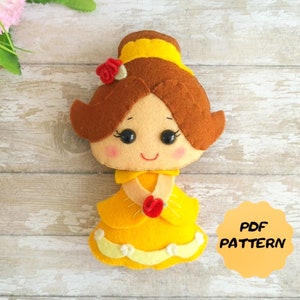 May include: A felt doll pattern of Belle from Beauty and the Beast. The doll is wearing a yellow dress with a red rose. The pattern is available as a PDF download.  PDF PATTERN
