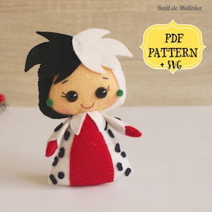 May include: A felt doll of Cruella de Vil from Disney's 101 Dalmatians. The doll is wearing a red dress with black spots and a white and black wig. The doll has a smiling face with green earrings.