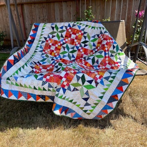 Good Fortune lap quilt or wall hanging in beautiful orange, red, green and blue - 57 x 57 inches - designed by Bonnie Hunter