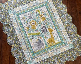 Scalloped Edge child size quilt with baby animals in neutral colors