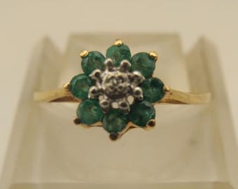 10k Y gold Emerald and Diamond cluster Ring  Size 6 1/2