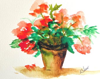 May include: Watercolor painting of a potted plant with vibrant red and orange flowers and green leaves. The flowers are in a brown pot, and the artwork is signed "A. Shaw". The painting is on a white background.