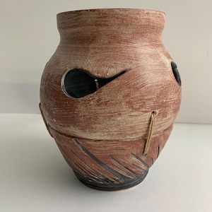Red-Brown Carved Vessel