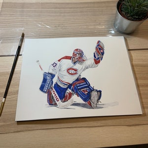 May include: A watercolour painting of a hockey goalie in action. The goalie is wearing a white jersey with red and blue accents, and the number 33 on the back. The goalie is wearing a red helmet and is making a save with his left hand. The goalie is wearing blue and white pads and a blue and white glove. The goalie is wearing a white stick with a blue and white blade. The goalie is on the ice and is in a crouched position. The background is white.