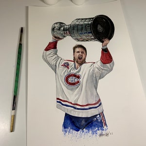 May include: A watercolour painting of a hockey player holding aloft the Stanley Cup trophy. The player is wearing a white jersey with red and blue trim, and the number "C" on the front. The player is also wearing blue trousers and white skates. The background is a white canvas with a blue splatter effect.