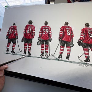 May include: Watercolor painting of five hockey players wearing red and white jerseys with their numbers visible. The players are standing in a line, facing forward, with their sticks in their hands.