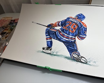 May include: Watercolor painting of a hockey player in a blue, orange, and white uniform with the number 29 and the name Draisaitl on the back. The player is in action, kneeling on the ice with a hockey stick.