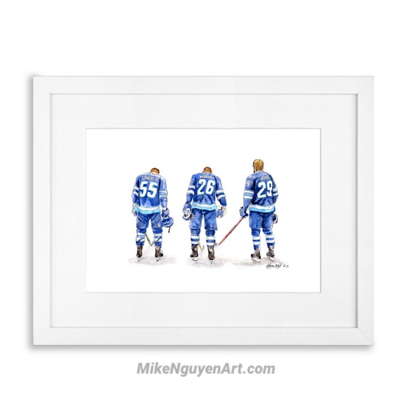 May include: Watercolour painting of three hockey players wearing blue and white jerseys with their backs to the viewer. The players are wearing numbers 55, 26, and 29. The painting is framed in a white frame.