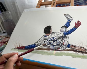 以下が含まれることがあります： ベースにスライディングする野球選手の水彩画。選手は「CLEMENT」と22番の白いジャージを着ています。このアートワークは、スポーツのアクションと動きを捉え、青、赤、茶色のトーンが特徴です。