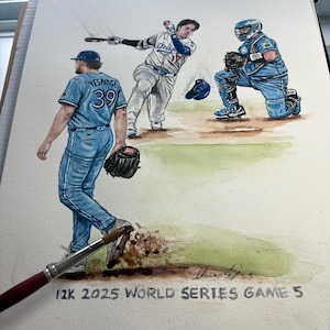 May include: Watercolor painting of a baseball game scene. A batter swings, a catcher kneels, and a pitcher walks away. The painting is signed and includes the text "12K 2025 WORLD SERIES GAME 5". The players are wearing blue and white uniforms.