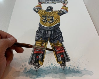 May include: A watercolor painting of a hockey player holding up the Stanley Cup trophy. The player is wearing a gold and black jersey with the number 33 on the back. The player is wearing black pants and red and black goalie pads. The player is standing on a blue and white ice surface.