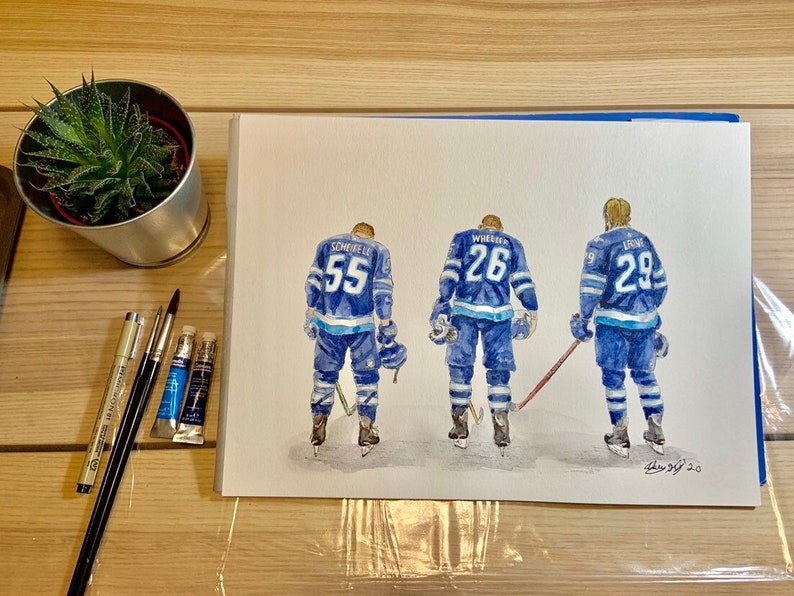 May include: Watercolour painting of three hockey players wearing blue and white jerseys with their numbers on the back. The players are facing away from the viewer and are standing on a white background. The painting is signed "Drew 3/2 20".