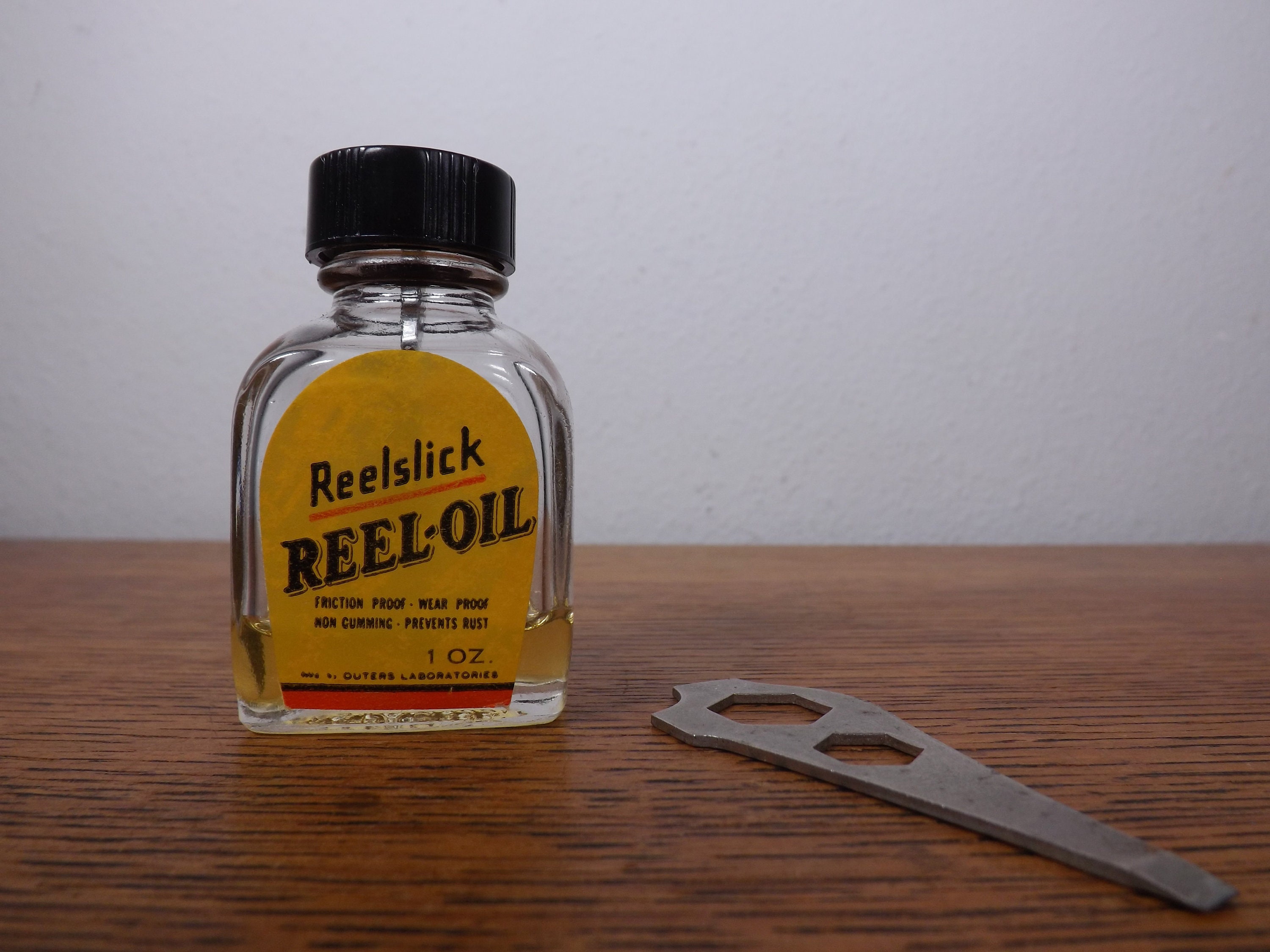 Reel-oil, Reelslick Vintage Bottle With Partial Contents and Nut