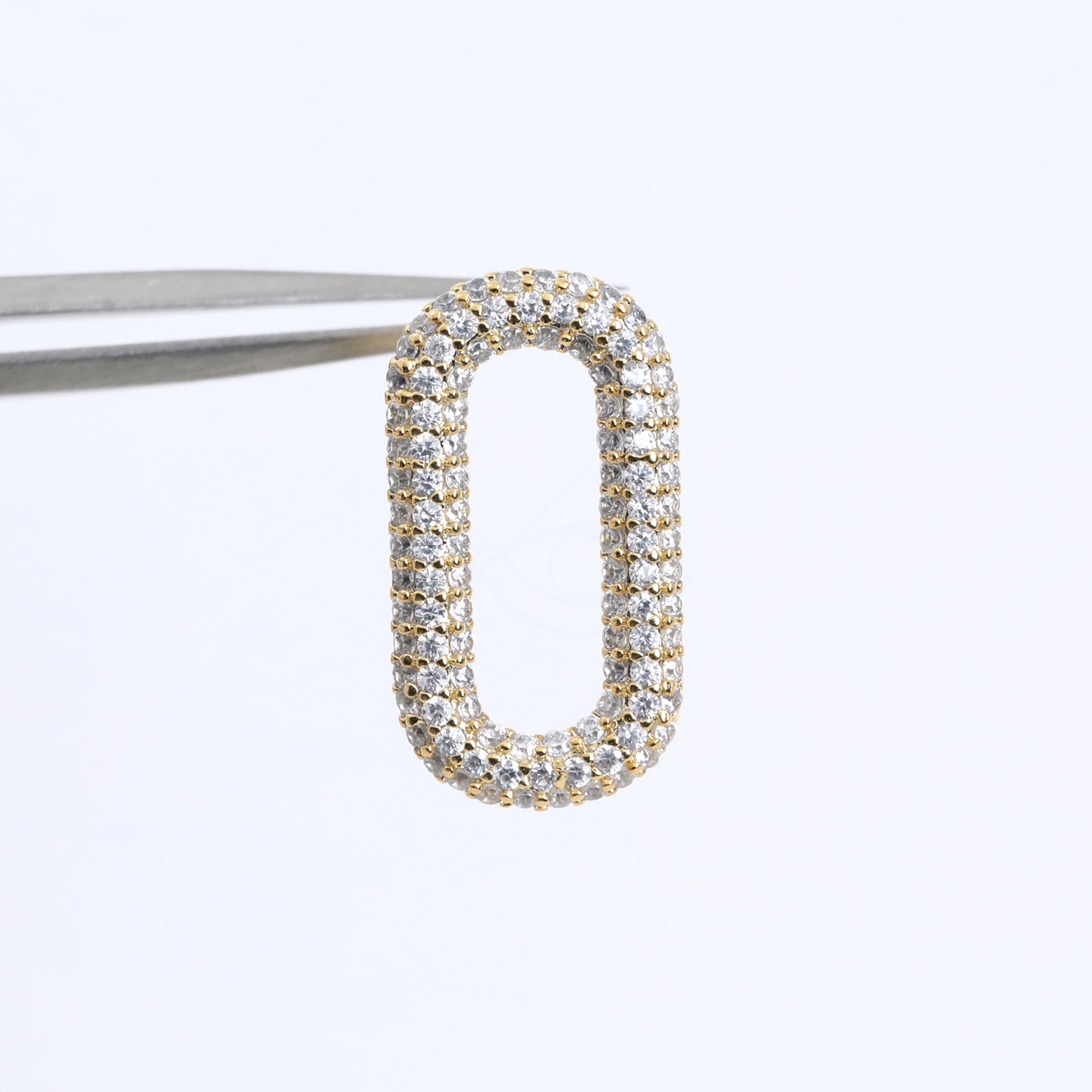 5661012 / Cubic Oval / Rhodium Plated Brass With CZ Stud