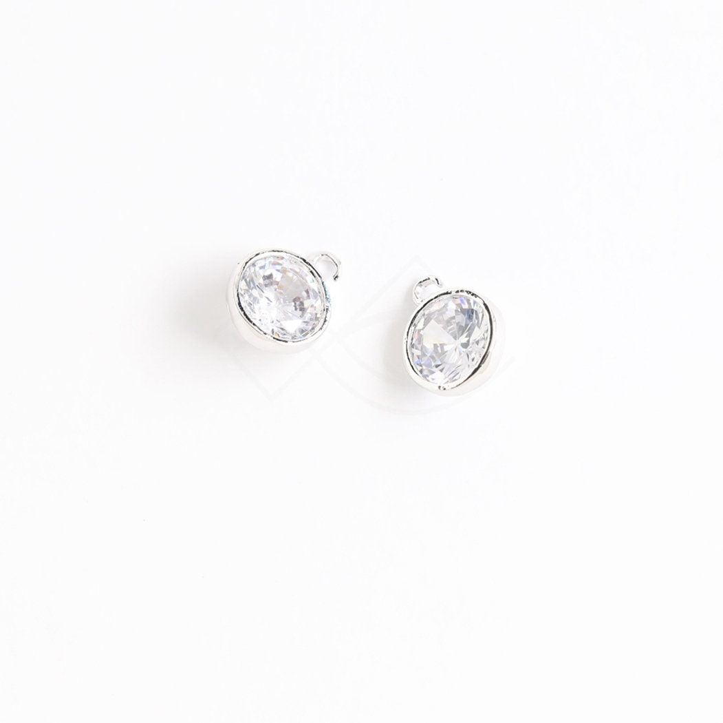 3637041 / Round Bezel Cubic / 16k Gold Plated Brass With CZ