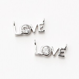 3255012 / Love / Messing rhodiniert mit CZ Stecker 12.5 mm x 5,7 mm / 0,4g / 2Stk