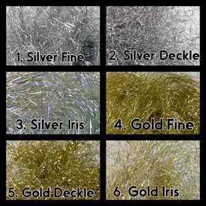 May include: Six samples of metallic thread for fly tying. The samples are arranged in a grid of two rows and three columns. The top row shows silver fine, silver deckle, and the bottom row shows gold fine, gold deckle, and gold iris.