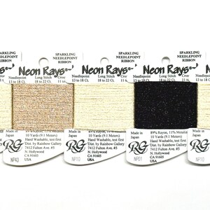 May include: Five cards of Neon Rays sparkling needlepoint ribbon, each containing 10 yards of thread. The colors include light gold, metallic copper, light gold, black, and light gold. Each card features product details and technical specifications.