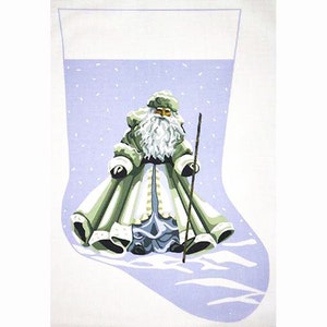 May include: A white stocking with a purple background featuring a green and white Santa Claus holding a staff. The Santa Claus is standing in a snowy scene.