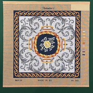 May include: A needlepoint canvas with a floral design featuring a yellow rose in a blue and gold circular frame. The canvas is surrounded by a gold and black border with a repeating pattern. The text "Gobelin L" is in the upper left corner. The text "50x50" is in the lower left corner. The text "MADE IN EU" is in the center. The text "46,362" is in the lower right corner.