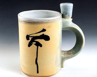 Clever thumb bump, original brush-stroke graphic permanently fired into the glaze. Handcrafted handle. Great Collectible.