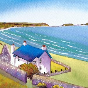 May include: Watercolour painting of a coastal scene with a white cottage, blue roof, and stone wall. The artwork depicts a beach, ocean, and a clear blue sky. The artist's signature is in the bottom right corner.