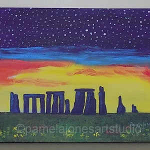 May include: A painting of Stonehenge at sunset with a starry night sky. The painting is done in acrylics on canvas and features a vibrant sunset with shades of orange, yellow, and red. The stones are painted in a dark purple color. The painting is signed "Pamela Jones" in the bottom right corner.