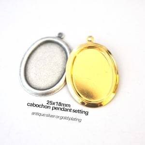 May include: Two oval-shaped pendant settings, one in antique silver and one in antique gold, both with a 25x18mm cabochon setting. 25x18mm cabochon pendant setting antique silver or gold plating