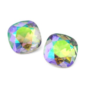 May include: Two iridescent square-shaped rhinestones with a rainbow of colors, including green, purple, and yellow.