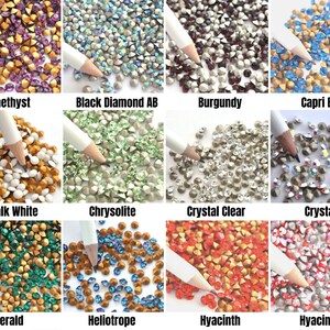 May include: Assortment of 12 colors of rhinestones, including amethyst, black diamond AB, burgundy, capri blue, chalk white, chrysolite, crystal clear, crystal AB, emerald, heliotrope, hyacinth, and hyacinth AB.