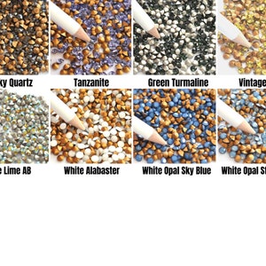 May include: Assortment of small, faceted, glass rhinestones in various colors, including smoky quartz, tanzanite, green tourmaline, vintage lime, vintage lime AB, white alabaster, white opal sky blue, and white opal star shine.