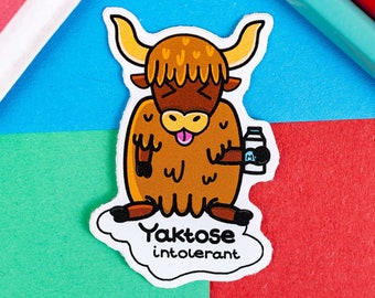 May include: A cartoon illustration of a brown yak with its tongue sticking out, holding a carton of milk. The yak is on a white cloud with the text "Yaktose intolerant" underneath.