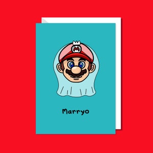 Marryo - Mario Engagement Wedding Card on red background with a white envelope underneath. Blue a6 congratulations card of a smiling nintendo mario character head wearing a white bridal wedding veil, underneath him is black text reading Marryo.