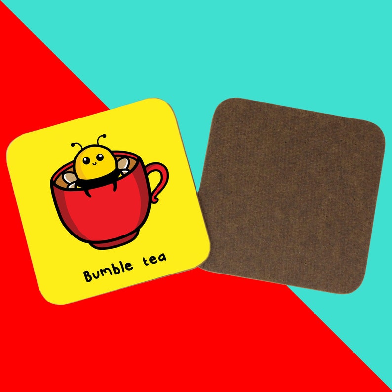 The Bumble Bee Tea Coaster on a red and blue background. The yellow wooden coaster features a cute bumble bee popping out a red cup of tea with black text underneath reading bumble tea, on the right is the wooden underside of the coaster.