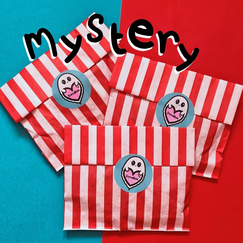 Mystery Enamel Pin Bags on red & blue card. Three red & white stripe candy bags with a innabox ghost logo sticker with text reading mystery. Surprise goodie bag of three enamel pins raising awareness for hidden disabilities and invisible illnesses.