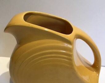 Yellow Fiesta Ware beverage pitcher