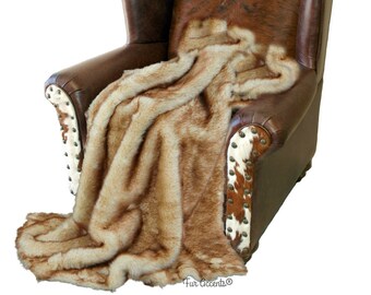 May include: A brown leather armchair with a cowhide pattern on the back and arms. A brown and white faux fur throw is draped over the chair. The chair has decorative studs on the arms and back.