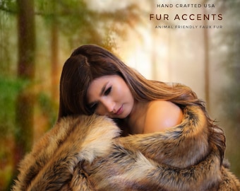 May include: A woman is wrapped in a brown and black faux fur throw blanket. The blanket is soft and fluffy, and the woman looks cozy and comfortable. The text "HAND CRAFTED USA FUR ACCENTS ANIMAL FRIENDLY FAUX FUR" is visible in the top right corner of the image.