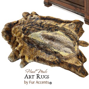 May include: A brown and black faux fur rug with a cowhide pattern. The rug is hand-made and has the text "Hand Made ART RUGS by Fur Accents®" printed on it.