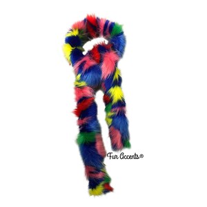 May include: A colourful faux fur scarf with a mix of pink, blue, yellow, red, and green fur. The scarf is tied in a loop and the ends are hanging down. The text "Fur Accents®" is visible at the bottom of the image.