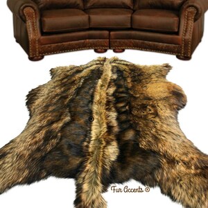 May include: A large brown and black faux fur rug with a long, shaggy pile. The rug is laid out on a white background. The text "Fur Accents®" is visible in the lower right corner of the rug.
