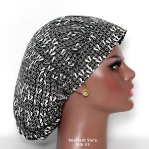 May include: A bouffant style scrub cap featuring a black fabric base with a repeating white leaf or vine pattern. The cap is worn on a mannequin head, and the text "Bouffant Style Silk #3" is printed in white at the bottom of the image.