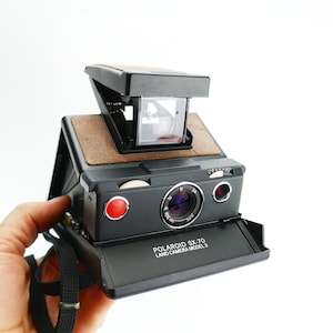 Fotocamera terrestre vintage Polaroid...SX-70 Modello 3 Pellicola istantanea Pelle in pelle usata