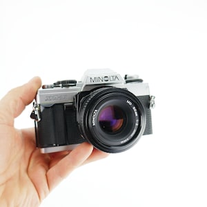 F*or parts or repair NOT working* Vintage Camera Minolta xg-m - md 50mm Lens - Film camera