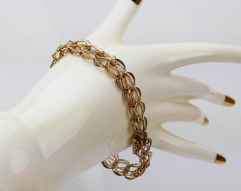 Pulsera vintage de joyería con dijes Airflex chapados en oro GF