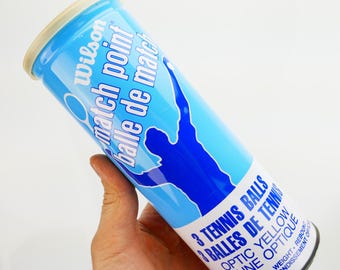 Lata de tenis con pelota Wilson Match Point y contenedor de lata