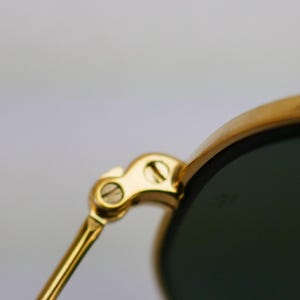 May include: A set of three ceramic mugs with a speckled, matte finish. The mugs are in shades of cream, light gray, and dark gray. Each mug has a simple, minimalist design, perfect for coffee or tea.