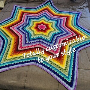 May include: A star-shaped crochet blanket featuring concentric rings of vibrant rainbow colors including red, orange, yellow, green, blue, and purple. The text "Totally customizable to your style" is overlaid in white across the center of the blanket.