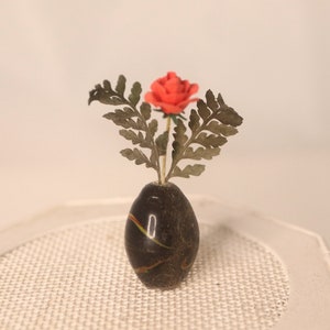 One rose in each of the 3 different arrangements